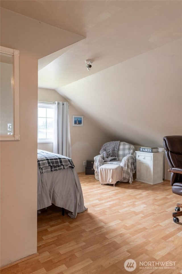 4200 N Pl, Seaview, WA 98644 - bedroom featuring light wood-type flooring and vaulted ceiling