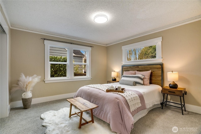 bedroom with carpet floors, ornamental molding, baseboards, and a textured ceiling