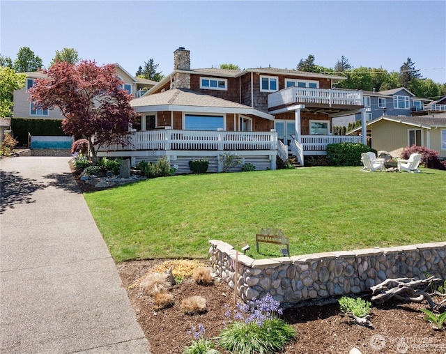 6926 Holeman Ave, Blaine, WA 98230 - rear view of property with a lawn, a chimney, and a balcony