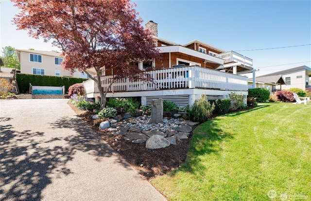 6926 Holeman Ave, Blaine, WA 98230 - rear view of house with a lawn and a chimney