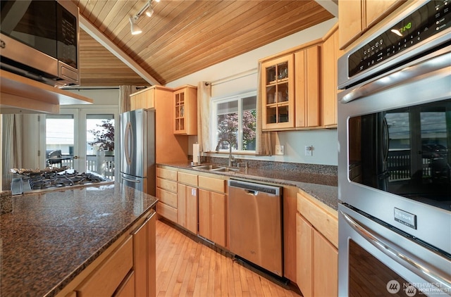 6926 Holeman Ave, Blaine, WA 98230 - kitchen featuring a healthy amount of sunlight, light wood finished floors, a sink, wood ceiling, and appliances with stainless steel finishes
