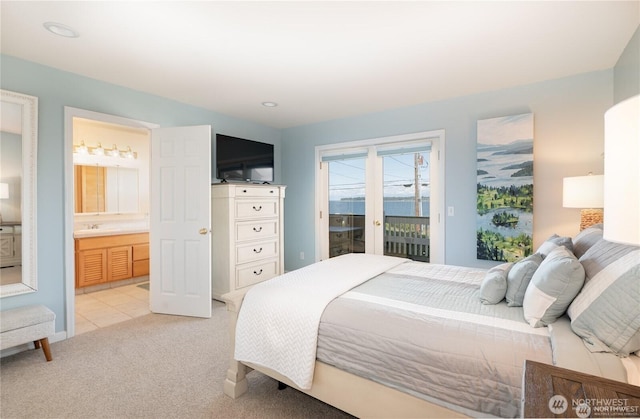 6926 Holeman Ave, Blaine, WA 98230 - bedroom featuring access to exterior, ensuite bathroom, and light carpet