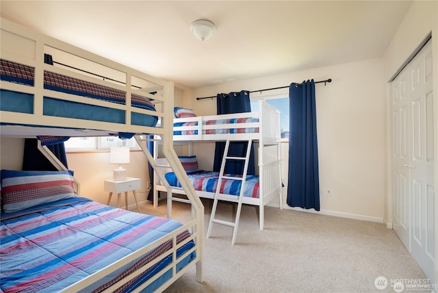6926 Holeman Ave, Blaine, WA 98230 - bedroom featuring multiple windows, carpet, a closet, and baseboards