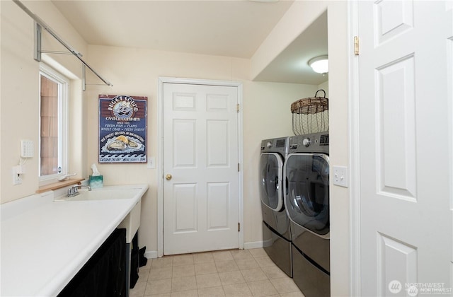 6926 Holeman Ave, Blaine, WA 98230 - laundry area featuring laundry area, washing machine and dryer, baseboards, and a sink