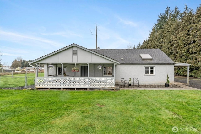 139 N Star Dr, Chehalis, WA 98532 - rear view of property featuring roof with shingles, fence, a carport, and a yard