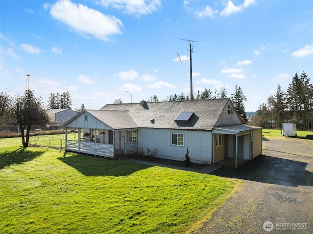 139 N Star Dr, Chehalis, WA 98532 - back of property with fence, stucco siding, a yard, and a shingled roof