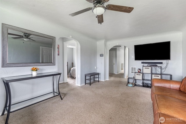 139 N Star Dr, Chehalis, WA 98532 - living area with arched walkways, carpet, baseboards, and ceiling fan
