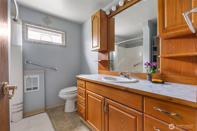 139 N Star Dr, Chehalis, WA 98532 - bathroom featuring toilet, vanity, walk in shower, baseboards, and visible vents