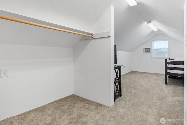 139 N Star Dr, Chehalis, WA 98532 - walk in closet featuring an AC wall unit, lofted ceiling, and carpet floors