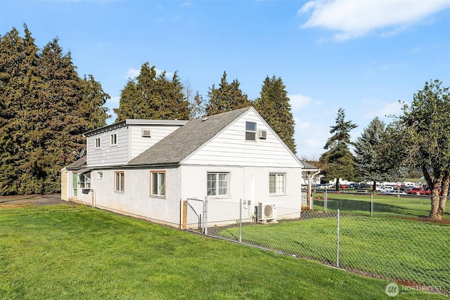 139 N Star Dr, Chehalis, WA 98532 - view of side of home with ac unit, a shingled roof, fence, and a lawn