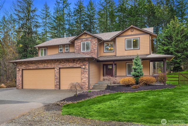 4111 161st Ave NE, Snohomish, WA 98290 - view of front of house featuring driveway, covered porch, a shingled roof, and a front yard
