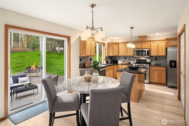 4111 161st Ave NE, Snohomish, WA 98290 - dining room with light wood-style floors and recessed lighting