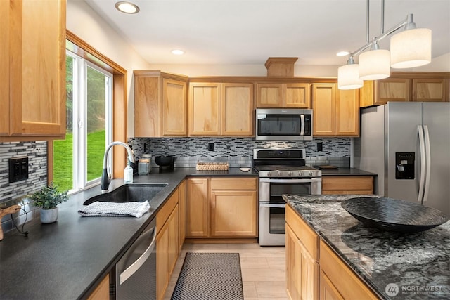 4111 161st Ave NE, Snohomish, WA 98290 - kitchen featuring decorative backsplash, a sink, a healthy amount of sunlight, and appliances with stainless steel finishes