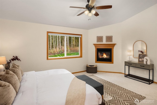 4111 161st Ave NE, Snohomish, WA 98290 - bedroom featuring baseboards, ceiling fan, carpet, and a glass covered fireplace
