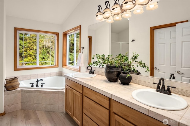 4111 161st Ave NE, Snohomish, WA 98290 - full bathroom featuring a sink, a stall shower, lofted ceiling, and a bath