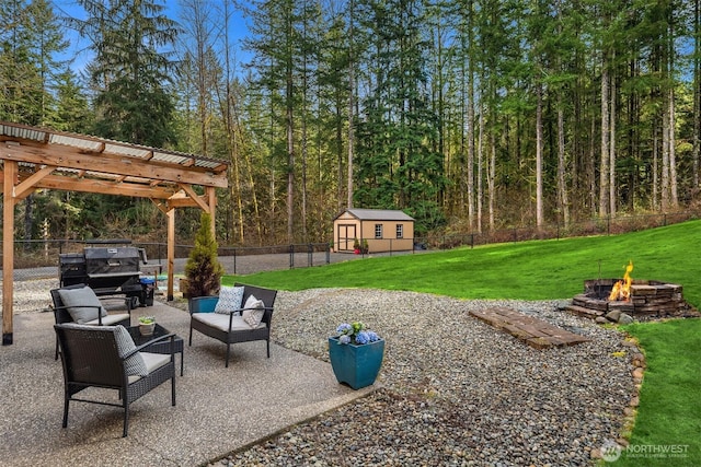 4111 161st Ave NE, Snohomish, WA 98290 - view of patio featuring a fenced backyard, an outbuilding, an outdoor living space with a fire pit, a pergola, and a shed