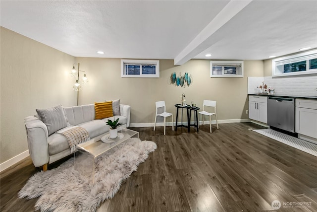 living room featuring recessed lighting, baseboards, and dark wood-style flooring