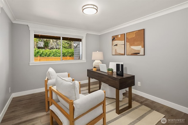 office area featuring baseboards, crown molding, and wood finished floors