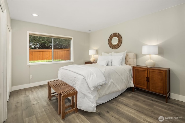 bedroom with wood finished floors, baseboards, and recessed lighting