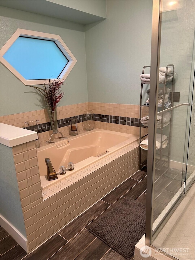 24100 NE 27th Pl, Sammamish, WA 98074 - bathroom with a garden tub, wood finished floors, and a shower stall