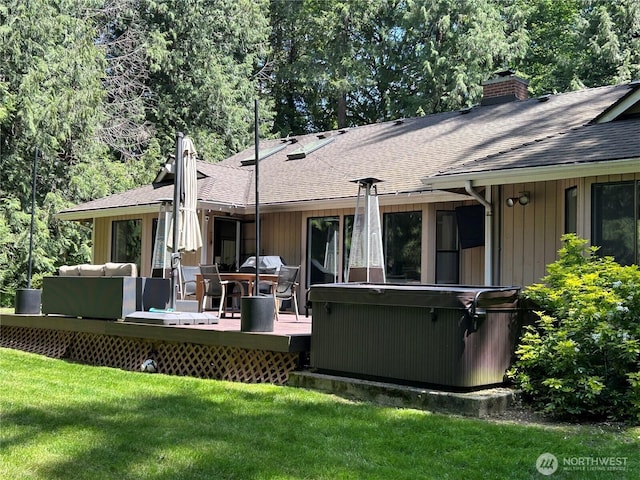 24100 NE 27th Pl, Sammamish, WA 98074 - back of house with a hot tub, roof with shingles, a chimney, a yard, and a wooden deck