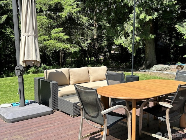 24100 NE 27th Pl, Sammamish, WA 98074 - wooden deck with outdoor lounge area, outdoor dining space, and view of wooded area
