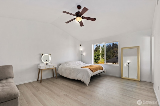 21813 43rd Avenue Ct E, Spanaway, WA 98387 - bedroom with lofted ceiling, light wood finished floors, baseboards, and a ceiling fan