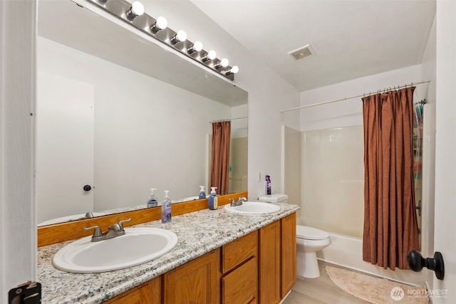 21813 43rd Avenue Ct E, Spanaway, WA 98387 - bathroom featuring toilet, shower / bath combination with curtain, and double vanity
