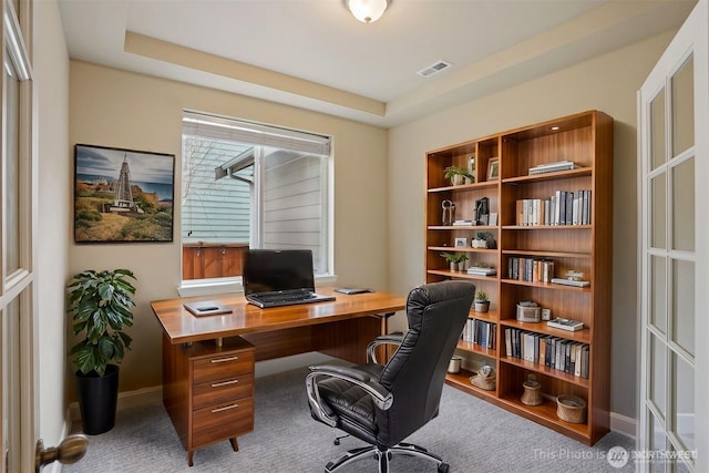 office featuring baseboards, visible vents, and carpet floors