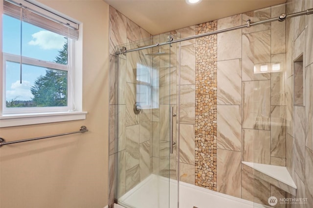 bathroom with a shower stall