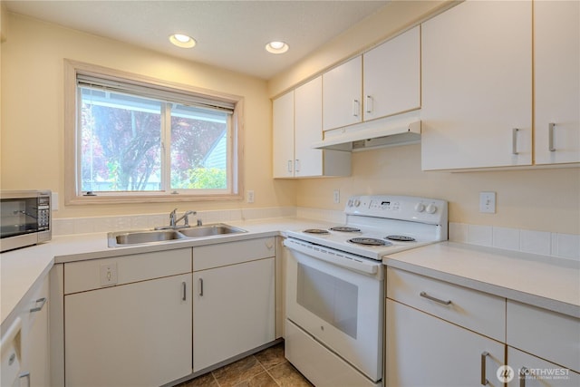 kitchen with stainless steel microwave, a sink, light countertops, under cabinet range hood, and white electric stove