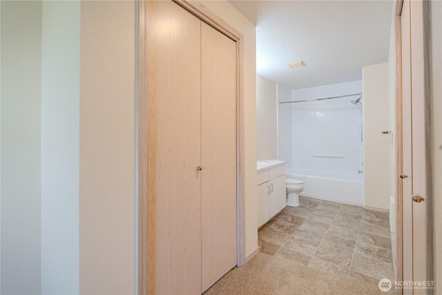 bathroom featuring visible vents, toilet,  shower combination, and vanity