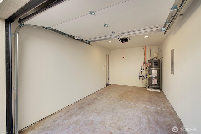 garage featuring strapped water heater, electric panel, and a garage door opener