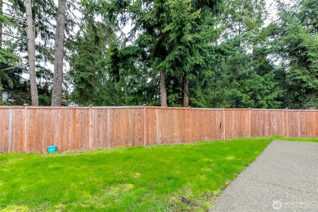 view of yard featuring fence