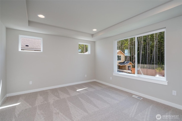 2406 SW Ridgeway Dr, Oak Harbor, WA 98277 - unfurnished room with baseboards, a raised ceiling, recessed lighting, and carpet