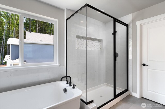 2406 SW Ridgeway Dr, Oak Harbor, WA 98277 - full bathroom featuring a soaking tub, a shower stall, and tile patterned floors