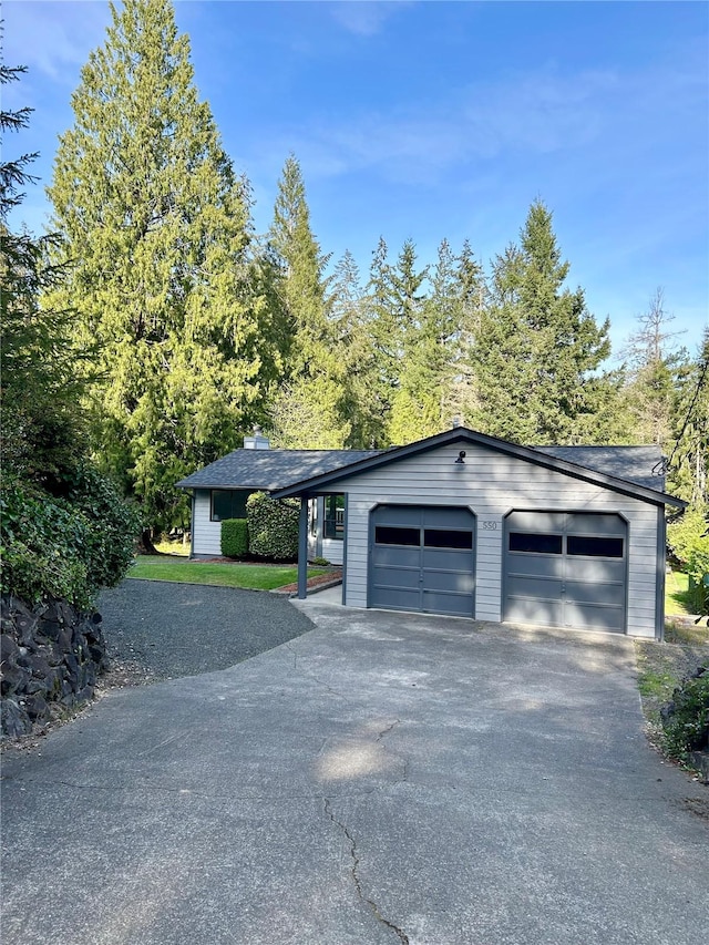 garage with aphalt driveway