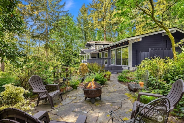 11925 Manzanita Ln NE, Bainbridge Island, WA 98110 - view of patio featuring an outdoor fire pit and a deck