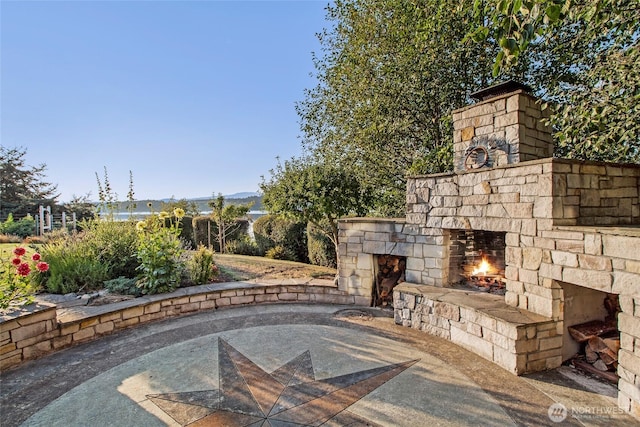 1935 False Bay Dr, Friday Harbor, WA 98250 - view of patio / terrace featuring an outdoor stone fireplace