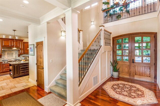 1935 False Bay Dr, Friday Harbor, WA 98250 - foyer with stairway, wood finished floors, crown molding, recessed lighting, and baseboards