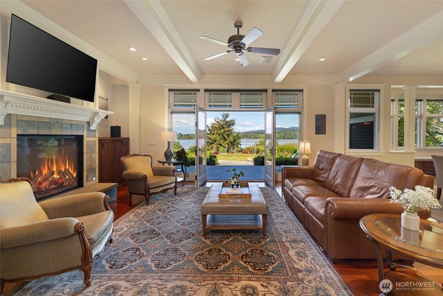 1935 False Bay Dr, Friday Harbor, WA 98250 - living room featuring beam ceiling, ceiling fan, wood finished floors, ornamental molding, and a fireplace