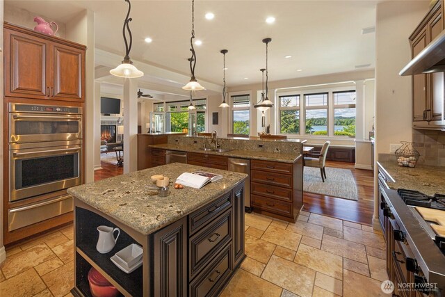 1935 False Bay Dr, Friday Harbor, WA 98250 - kitchen with a center island with sink, a warming drawer, appliances with stainless steel finishes, a sink, and recessed lighting