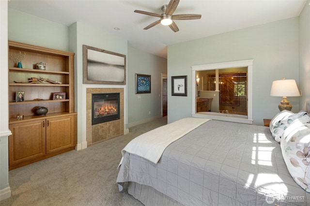 1935 False Bay Dr, Friday Harbor, WA 98250 - bedroom with a tile fireplace, light colored carpet, ceiling fan, and baseboards