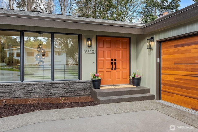 entrance to property featuring a garage