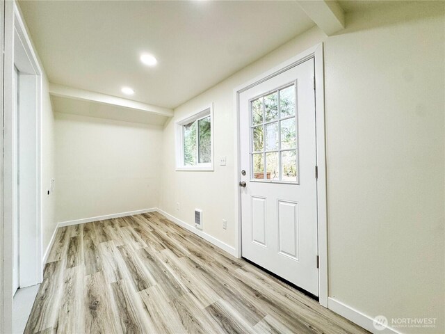 entryway with baseboards, light wood-style floors, visible vents, and recessed lighting