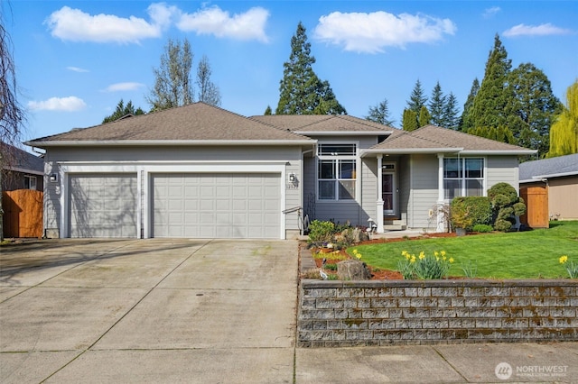 ranch-style house with a front yard, a garage, and concrete driveway