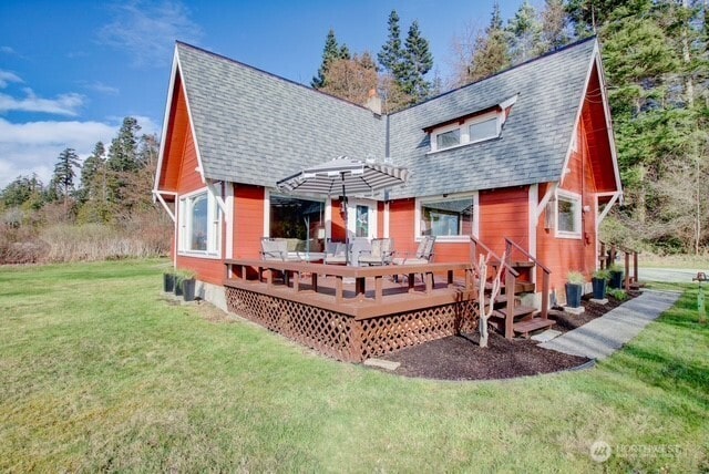 12312 Seabird Ln, Mount Vernon, WA 98273 - rear view of house featuring a shingled roof, a yard, and a deck