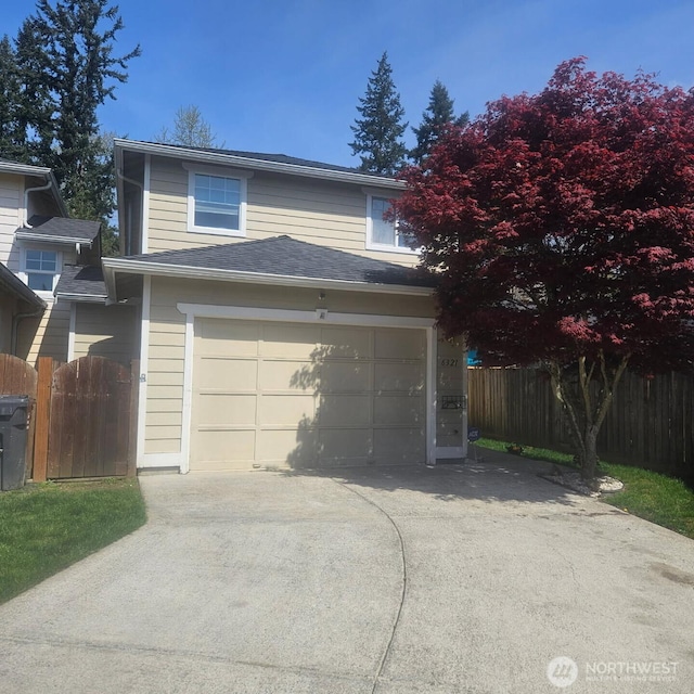 exterior space featuring driveway and fence