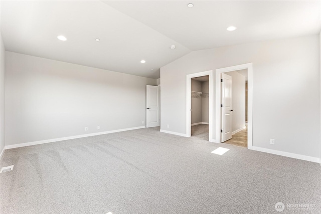 13906 178th Street Ct E Unit 62, Puyallup, WA 98374 - unfurnished bedroom with light colored carpet, baseboards, lofted ceiling, a walk in closet, and recessed lighting