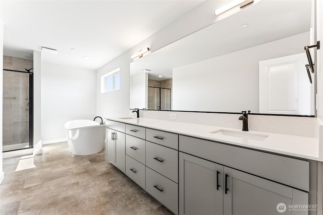 13906 178th Street Ct E Unit 62, Puyallup, WA 98374 - bathroom featuring a stall shower, double vanity, a freestanding tub, and baseboards